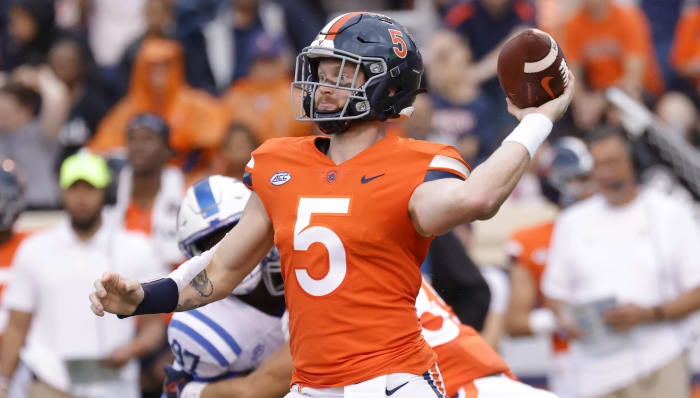 Virginia Cavaliers quarterback Brennan Armstrong (5) passes the ball against the Duke Blue Devils during the first quarter at Scott Stadium.